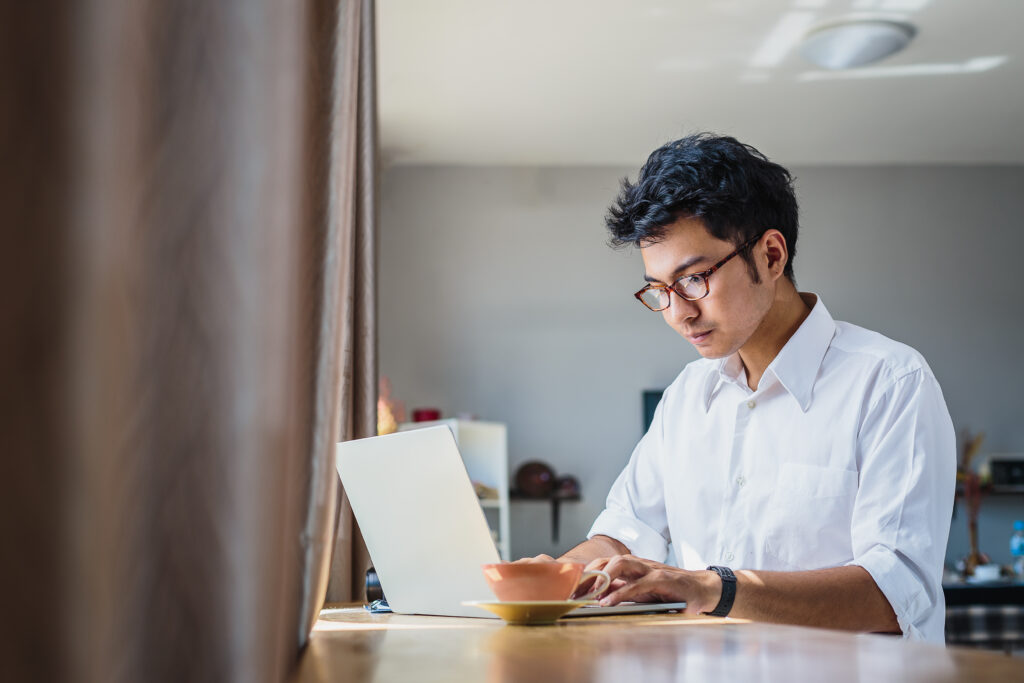 Young professional working with laptop computer